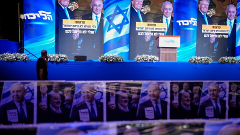A video wall displays images of Benjamin Netanyahu with President Trump at a Likud party event before the release of the first exit poll results in Israel's general election, in Jerusalem, on Tuesday.