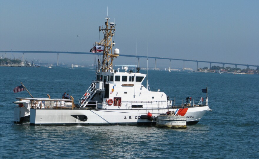 Coast Guard Patrol Boat Petrel (WPB 87350) anchored in the middle of San Diego harbor. The Coronado Bridge is in the background.