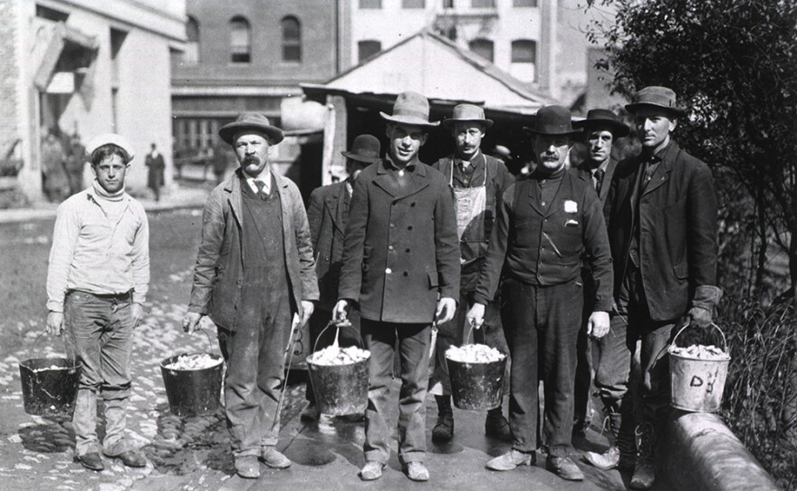 Workers holding buckets of rat bait. San Francisco, CA. 1907 or 1908.