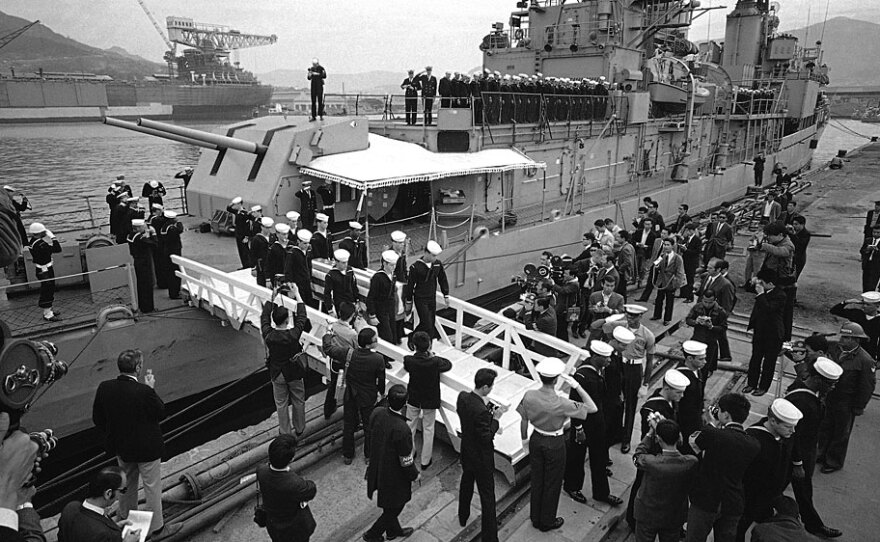 The body of aviation electronics technician Richard Edson Sweeney is brought ashore from the USS Tucker on its arrival at a port in Japan on April 20, 1969. The destroyer arrived with the bodies of two members of a 31-man crew who manned a U.S. reconnaissance plane shot down by North Korean jets five days earlier over the Sea of Japan.