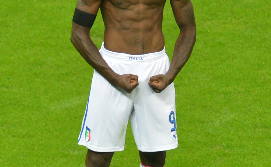 Italian forward Mario Balotelli celebrates after scoring the second goal during Italy's semifinal matchup with Germany in the Euro 2012 soccer championships in Warsaw, June 28. Italy went on to lose in the finals to Spain, but Balotelli has been hailed as a national hero, spurring debate over what constitutes Italian-ness.