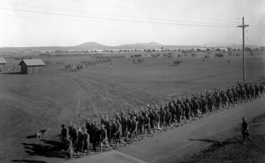 A photo of Camp Kearny in about 1918 shows soldiers marching in review.