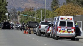 Law enforcement members line up near the the site of a mass shooting in San Bernardino, Dec. 2, 2015.