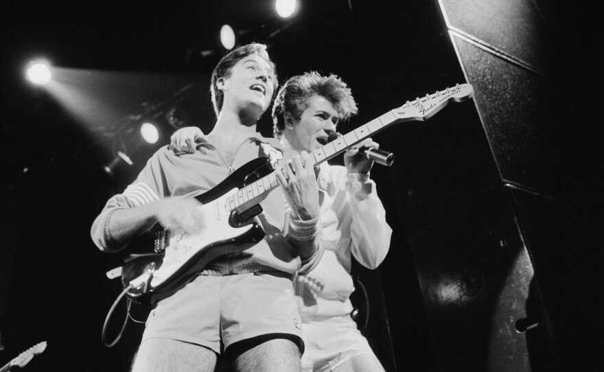 Andrew Ridgeley and George Michael of pop duo Wham! perform in London in November 1983.