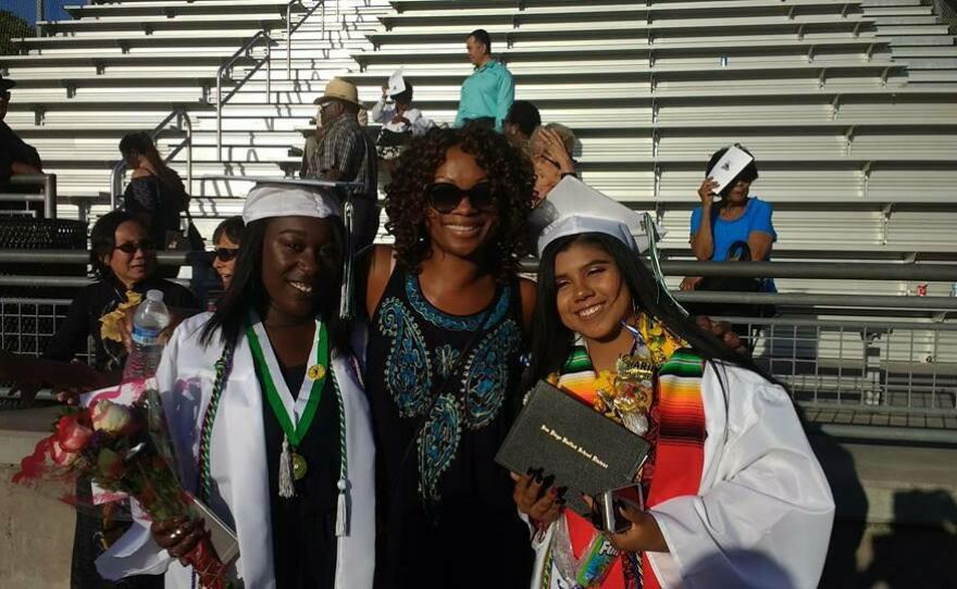 San Diego County Deputy Public Defender Geneviéve Jones-Wright poses in this undated photo with her foster daughter, Treasure (left), on her graduation.