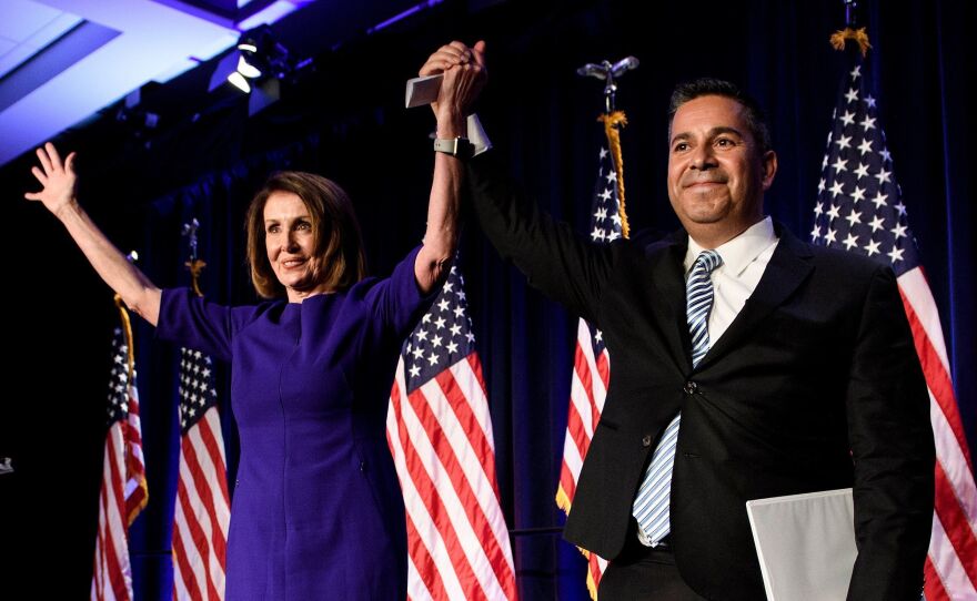 House Minority Leader Nancy Pelosi, D-Calif., and Representative Ben Ray Lujan, D-N.M., Democratic Congressional Campaign Committee chairman, celebrate.