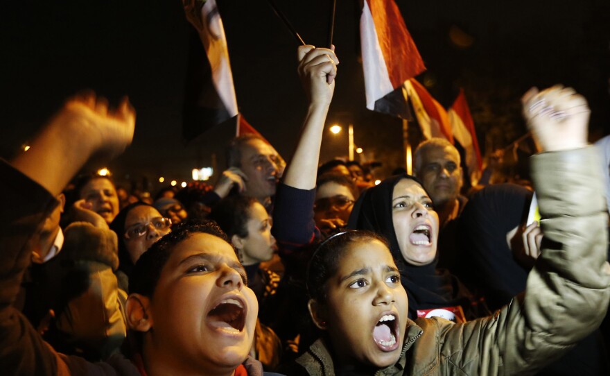 Protesters chant slogans during a demonstration in front of the presidential palace in Cairo, Egypt, on Sunday.