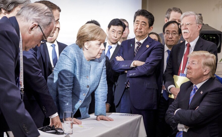Germany's Chancellor Angela Merkel (center) speaks with President Trump during the Group of Seven summit in La Malbaie, Quebec, Canada, on June 9. The Trump administration has surprised and frustrated allies in areas including trade, security, human rights and the environment.