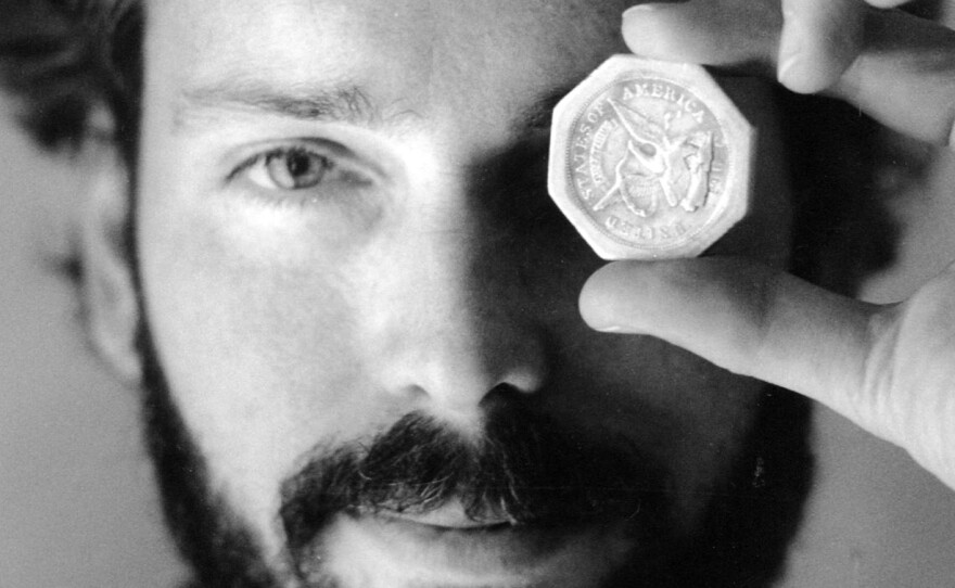 A November 1989 photo of Tommy Thompson holding a $50 pioneer gold piece retrieved from the wreck of the SS Central America. Thompson, who had been on the lam for two years, was arrested on Tuesday.