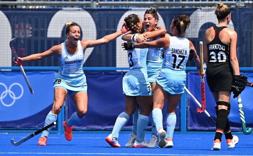 Argentina's Maria Victoria Granatto, center, celebrates with teammates Julieta Jankunas, left, Agustina Gorzelany, second from left, and Rocio Sanchez Moccia after scoring against Germany during their women's quarter-final match on August 2.