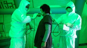 Image of someone being tested for radiation exposure. FRONTLINE correspondent Miles O'Brien examines the implications of the Fukushima accident for U.S. nuclear safety in "Nuclear Aftershocks."