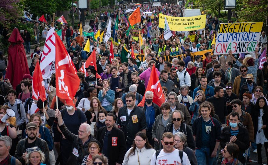 Protesters march during the annual May Day rally, marking International Workers' Day, in Paris on Sunday.