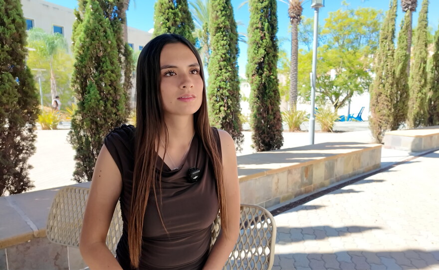 CSUSM student Hannah Herd sits on a bench on campus, Oct. 9, 2026.