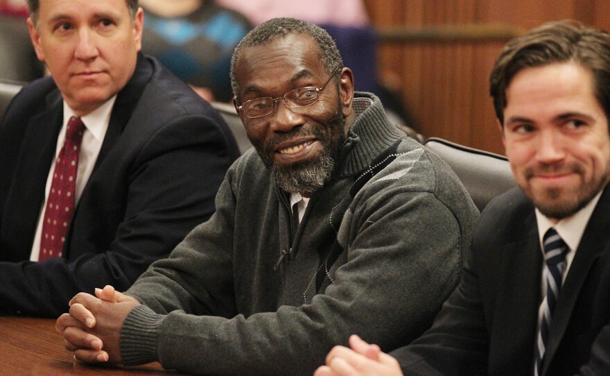 Ricky Jackson, center, smiles as a judge declares him free to leave.