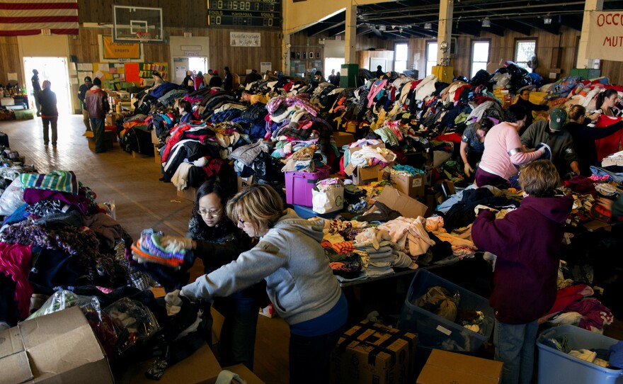 Thousands of food and clothing items are organized by Occupy Sandy volunteers in a school gymnasium in Rockaway Park, Queens, after Superstorm Sandy in November.