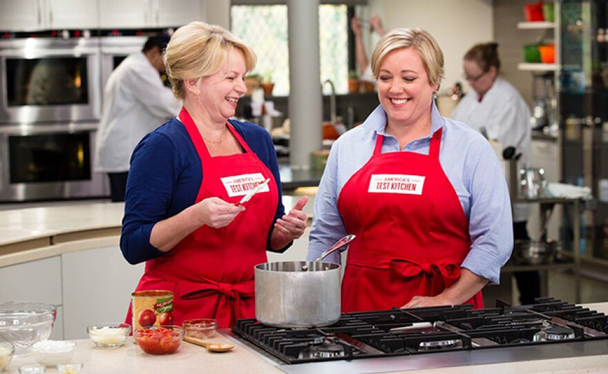 Host Julia Collin Davison (right) shows host Bridget Lancaster (left) how to make the best ground beef chili.