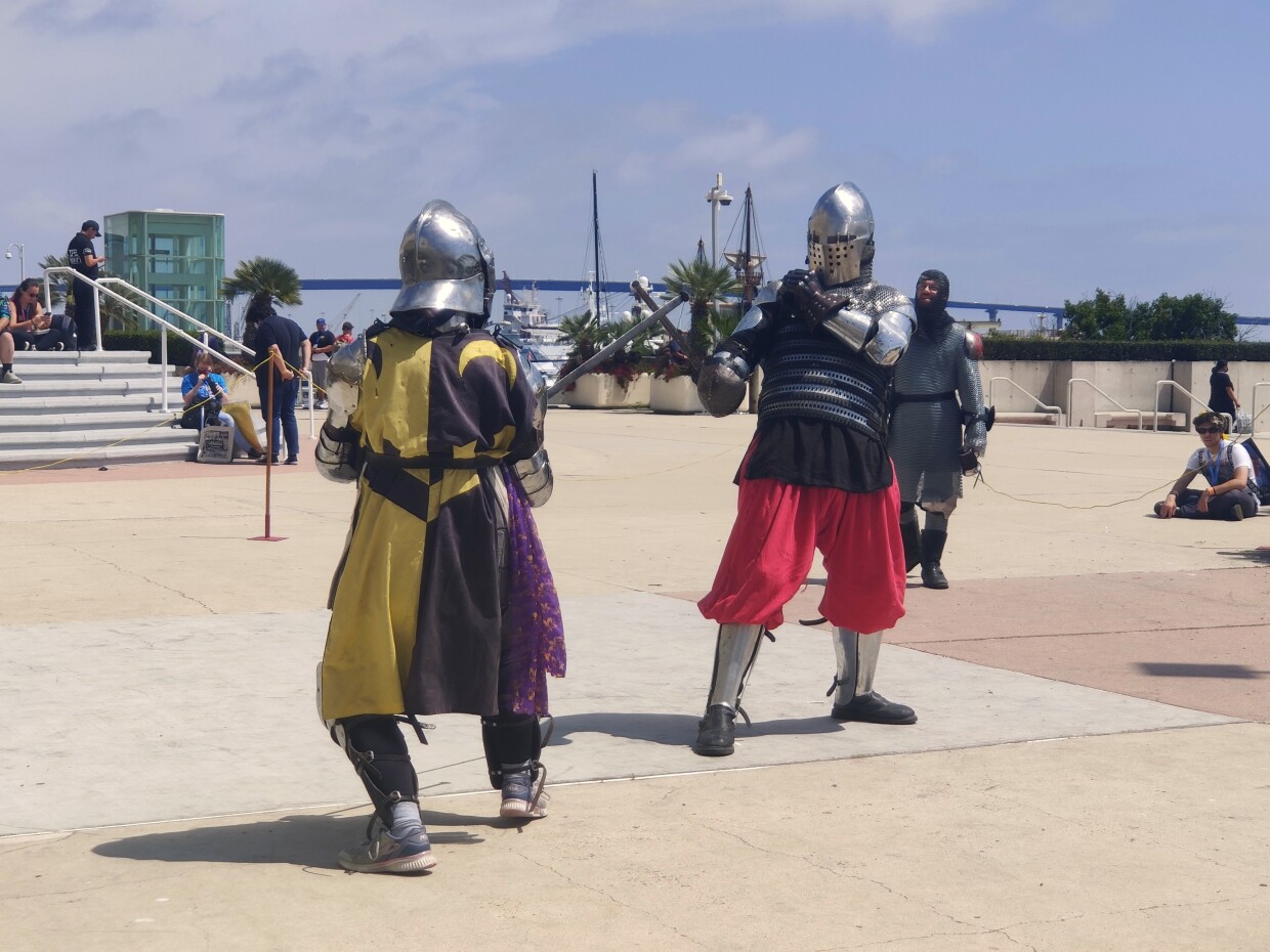 Members of the Kingdom of Terre Neuve spar outside the Convention Center's mezzanine, July 24, 2022.