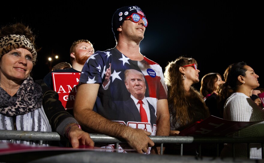 Supporters of Republican presidential candidate Donald Trump listen as he speaks during a campaign rally in October in Cedar Rapids, Iowa.