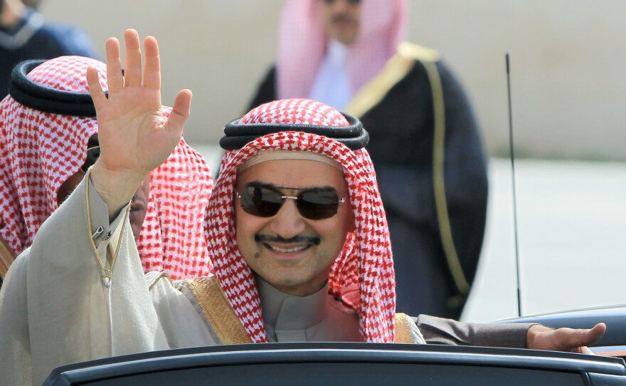 Saudi Prince Alwaleed bin Talal waves during an official visit to the West Bank city of Ramallah in 2014. The Saudi billionaire was detained last month in Riyadh and has not been seen since.