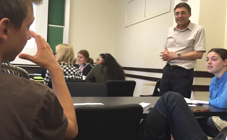 Dr. Carl Wieman listens in on a small group discussion during his introductory quantum mechanics course at Stanford University.
