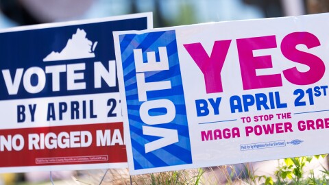 Signs are seen during the Virginia redistricting referendum on April 21 in Fairfax, Va.
