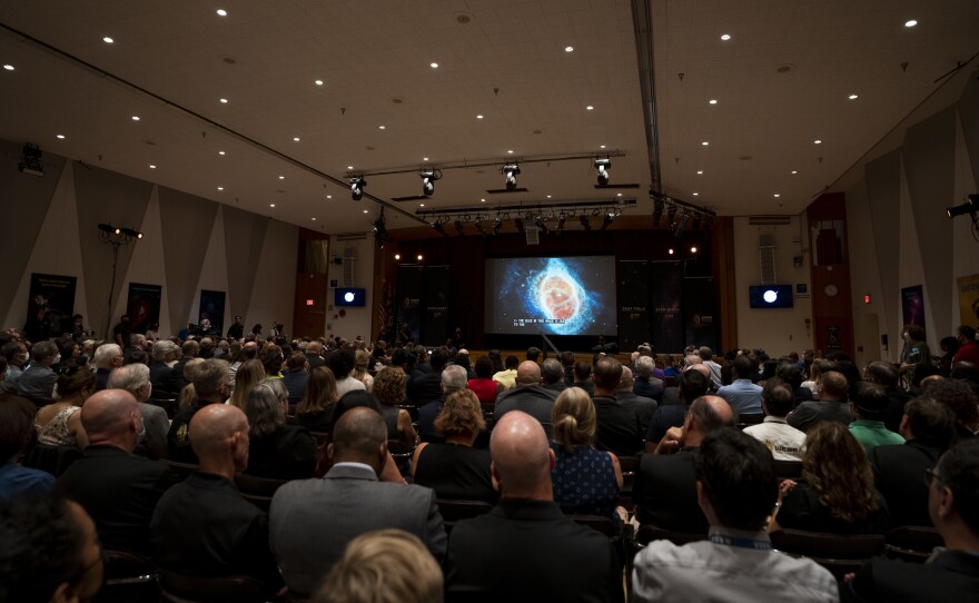 A crowd at NASA's Goddard Space Flight Center in Greenbelt, Md. watched as some of the first images got released on July 12.