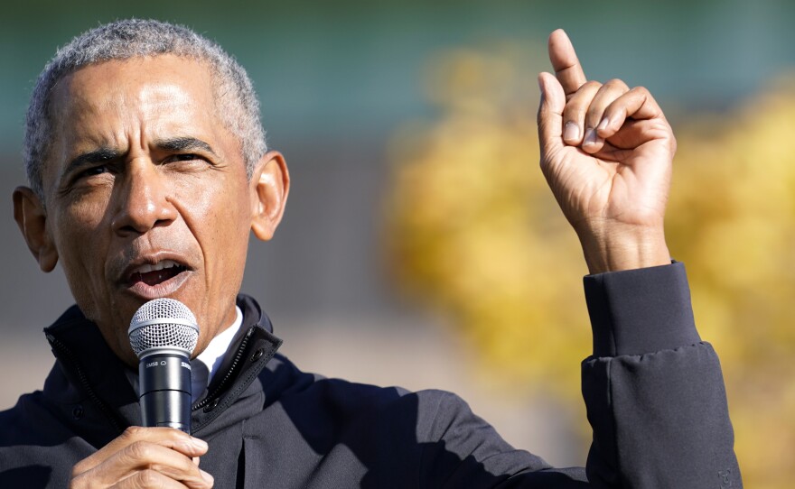 Former President Barack Obama speaks at a rally for Joe Biden in Flint, Mich. on Oct. 31. In an interview with NPR, Obama said Trump was "denying reality" by refusing to concede the election to Biden.