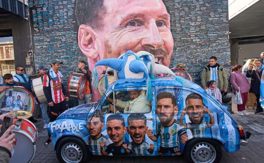 People sing happy birthday to Lionel Messi at a street mural of him in Buenos Aires, Argentina, June 24.