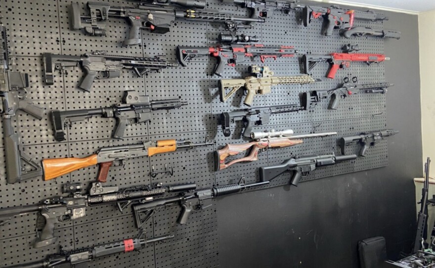 A wall in a "gun room" in Brian Downey's house held a range of powerful weapons, many of which were not registered, authorities say.