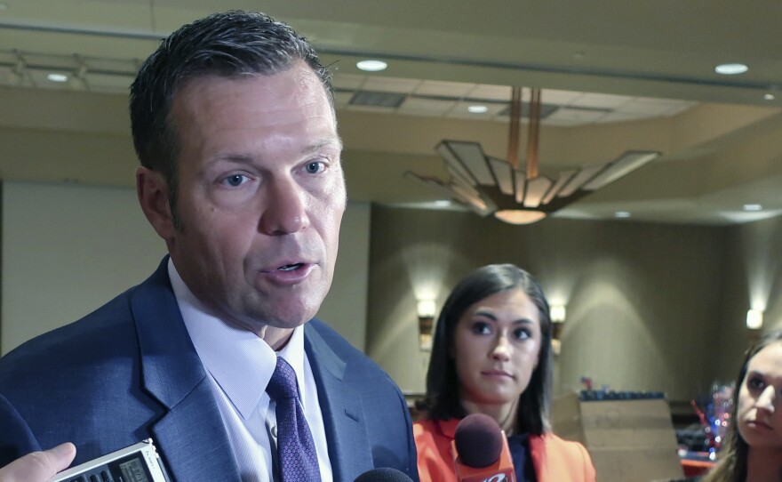 Kansas Secretary of State Kris Kobach speaks with reporters before his election night watch party for the Republican primary for governor on Tuesday in Topeka. Kobach is the state's top elections official.