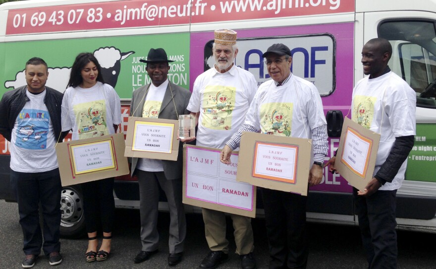 Rabbi Michel Serfaty, third from right, and employees of his French Jewish Muslim Friendship Association. He says he has only grown more determined to do his bridge-building work since the terror attacks in Paris in January.