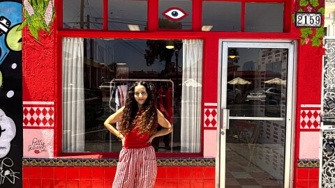 Artist Jiyan Rios Zandi stands outside of her shop, Brown Local Baby, on July 9, 2026.