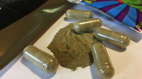 Kratom capsules are displayed in Albany, N.Y., Sept. 27, 2017. 