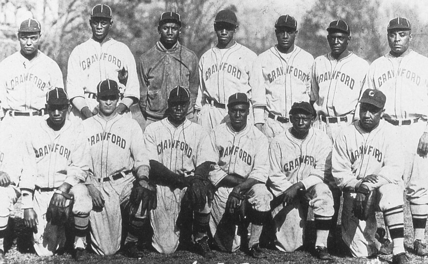 The Pittsburgh Crawfords team of 1932 included future Hall of Famers Satchel Paige (back row, second from left), Josh Gibson (to the right of Paige), and Oscar Charleston (far right). The team is seen here at a spring training site in Hot Springs, Ark.