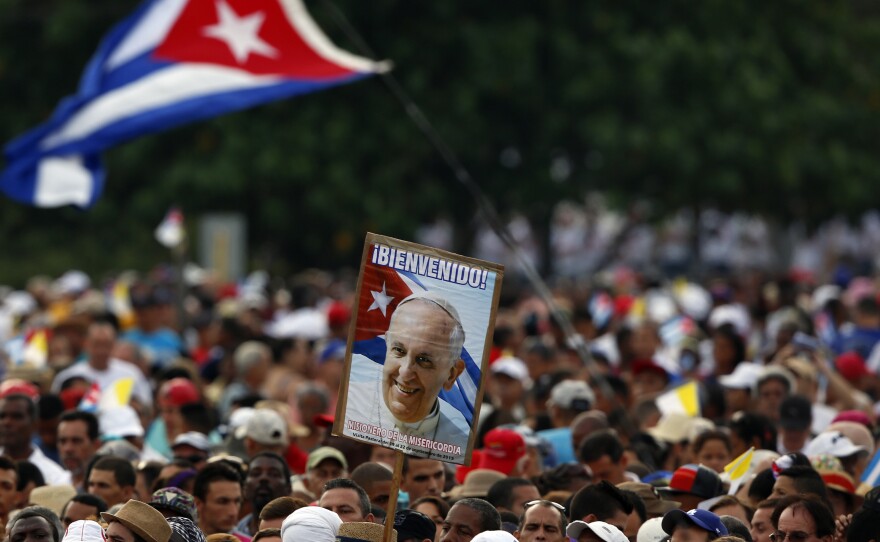 Faithful wait for the arrival of Pope Francis for a Mass in Revolution Plaza in Havana, Cuba, Sunday.