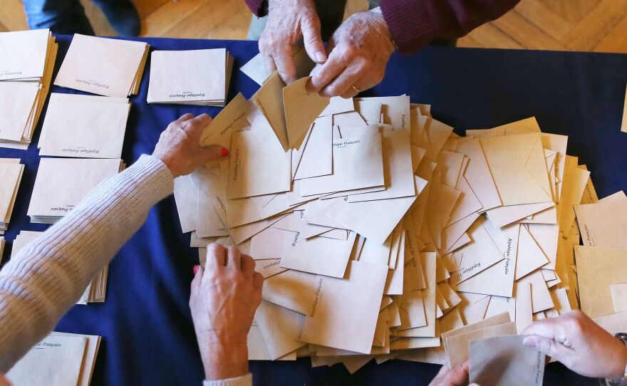 Ballots are prepared for counting at a polling station in Rouen, northern France, during the first round of the French presidential elections, on Sunday.