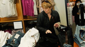 A woman shops at a clothing store in midtown Manhattan in New York City. The Commerce Department says retail sales in March grew 7.6 percent compared with a year ago.