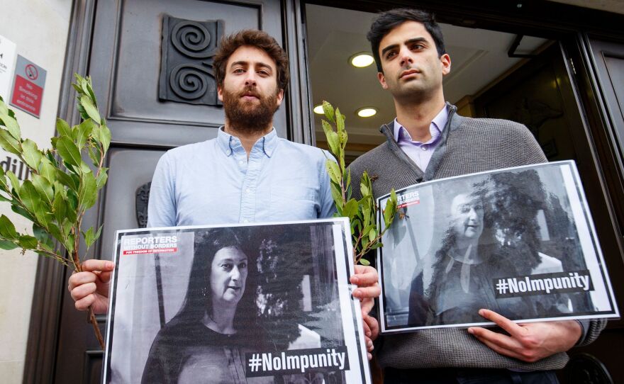 Matthew Caruana Galizia (left) and Paul Caruana Galizia, the sons of murdered Maltese journalist Daphne Caruana Galizia, attend a vigil outside the Maltese High Commission in London on April 16, six months after she was assassinated.