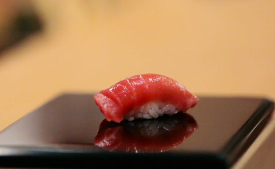 A piece of sushi on a plate. A scene from "Jiro Dreams of Sushi," a Magnolia Pictures release.