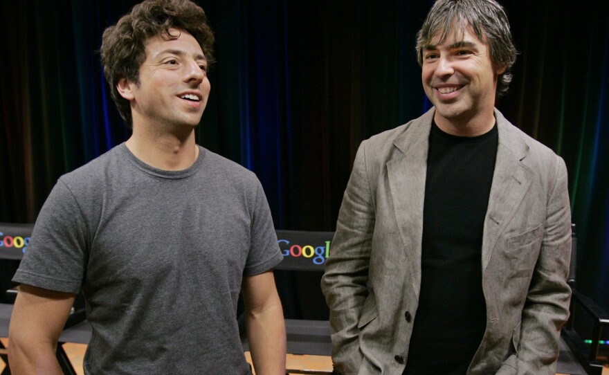 Google co-founders Sergey Brin (left) and Larry Page announced Tuesday they are stepping down from their leadership roles but will remain board members of Alphabet, Google's parent company.