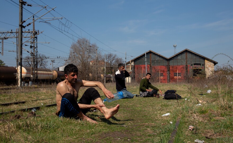 Jihan Zeb (left), from Afghanistan, and other asylum seekers found refuge in an abandoned railway station in the Serbian city of Subotica, on the border with Hungary. They say they have each tried to cross into neighboring EU countries more than 10 times — and will keep trying.