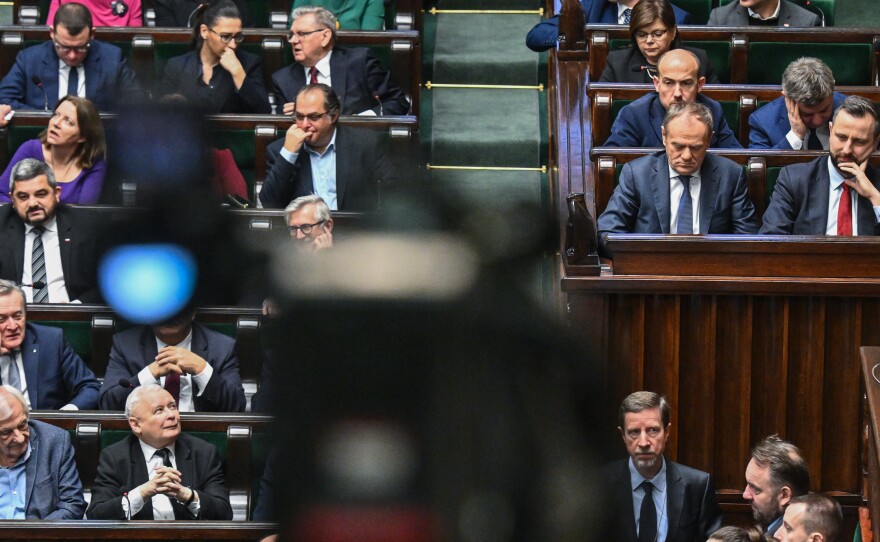 The leader of the conservative Law and Justice Party, Jaroslaw Kaczynski (left bottom), looks at Poland's prime minister, Donald Tusk (right), during a parliament session on Jan. 26, in Warsaw.