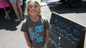 Liam Kennington, age 5, of Oceanside, writes an Earth-friendly pledge at the Oceanside Earth Festival, April 19th 2015. 