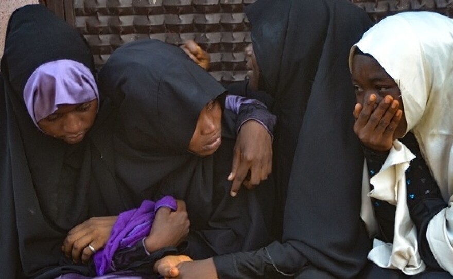 Mourners attend the burial of people killed in violent clashes in Abuja, Nigeria's capital, between Nigerian soldiers and members of the Islamic Movement of Nigeria.