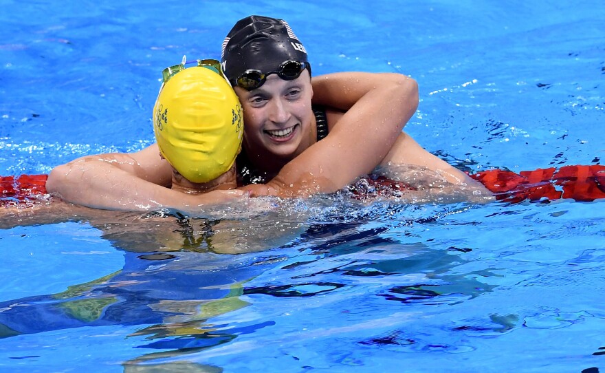 Katie Ledecky (right) celebrates with second-place finisher Sarah Sjostrom of Sweden after their 200-meter freestyle final in Rio de Janeiro.