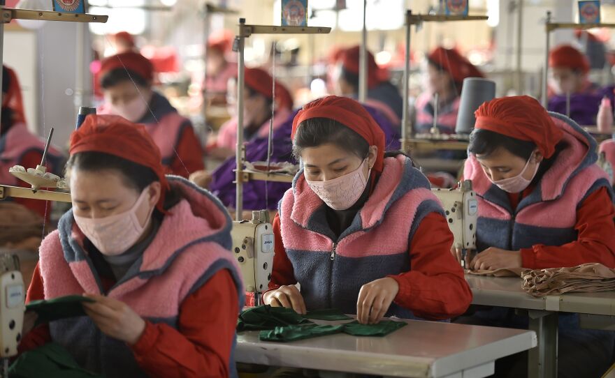 Workers in Pyongyang produce masks for protection against the new coronavirus. Experts say North Korea's track record of fighting epidemics does not bode well for its handling of the coronavirus outbreak.
