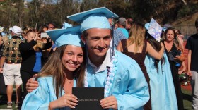 Zachary Patterson, 19, poses with his classmate Elisa Delle Monache, 17, at their graduation from University City High School, Tuesday, San Diego, CA, June 14, 2022.