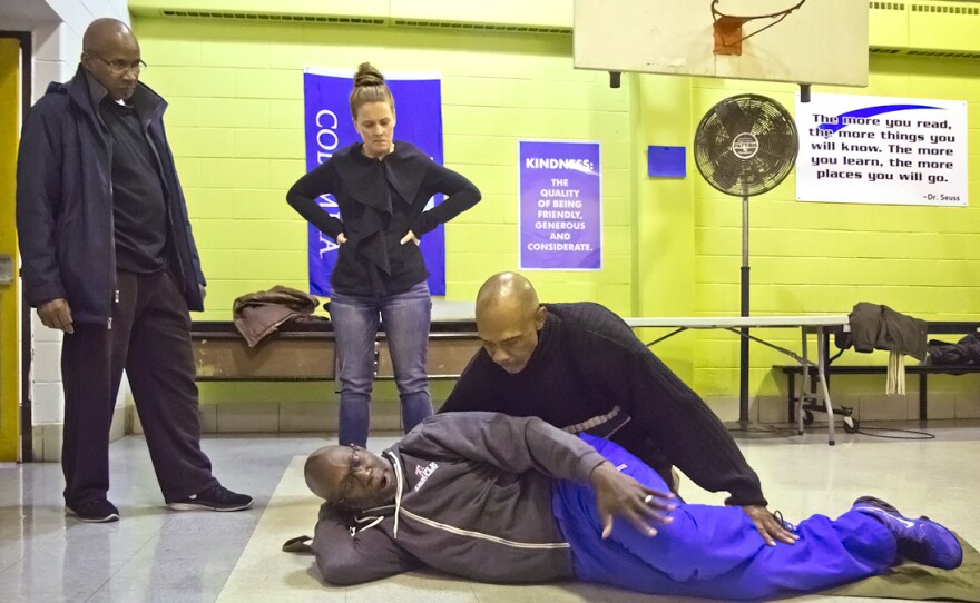 Neighbors learn how to move gunshot victims safely at the Fighting Chance emergency response training.