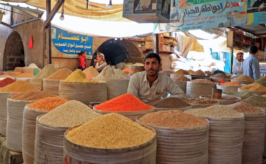 A vendor at a market in the war-torn Yemeni capital Sanaa, on Feb. 28, 2022. Ukraine supplies grains to many Middle Eastern countries; Russia's invasion of Ukraine could mean less bread on the table in Egypt, Yemen and elsewhere in the Arab world.