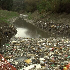 Trash fills a binational waterway in the Tijuana River Valley near the San Diego-Mexico border, Jan. 5, 2016.